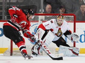 Mike Condon #1 of the Ottawa Senators stops a shot by Sergey Kalinin #51 of the New Jersey Devils in the first period on February 16, 2017 at Prudential Center in Newark, New Jersey. (Photo by Elsa/Getty Images)