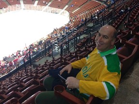 Documentary filmmaker Mark Greczmiel takes in an NHL game in Anaheim.