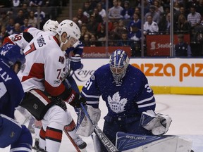 Leafs’ Frederik Andersen makes a save on Sens centre Kyle Turris last night in Toronto. (MICAHEL PEAKE/Postmedia Network)