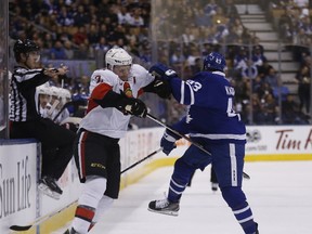 Sens’ Dion Phaneuf collides with Leafs’ Nazem Kadri during last night’s game in Toronto. (MICHAEL PEAKE/Toronto Sun)