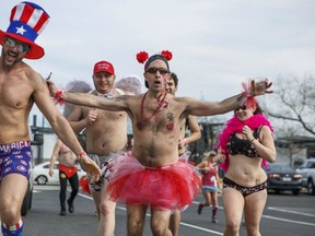 Participants race in the annual Cupid's Undie Run, Saturday, Feb. 18, 2017, in Philadelphia. In briefs, boxers, bras and bloomers, participants ran three-quarters of a mile in the Valentine's Day-related charity event benefiting sick children. (Jamie Kassa via AP)