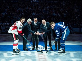 Ottawa Senators defenceman Erik Karlsson, left to right, with Brad Conacher, son of former Maple Leafs player Charlie Conacher, along with former Maple Leafs players Frank Mahovlich, Wendel Clark, Casey Kelly, daughter of former Maple Leafs player Red Kelly, and Toronto Maple Leafs defenceman Morgan Rielly. (THE CANADIAN PRESS/Aaron Vincent Elkaim)