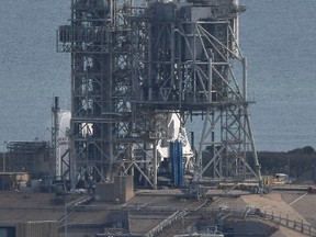 A SpaceX Falcon 9 rocket remains on launch Pad 39A at Kennedy Space Center, Fla., Saturday, Feb. 18, 2017.  (Craig Bailey/Florida Today via AP)