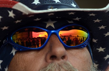 Air Force One is reflected in a pair of sunglasses as President Donald Trump arrives to speak at his "Make America Great Again Rally" at Orlando-Melbourne International Airport in Melbourne, Fla., Saturday, Feb. 18, 2017.  (AP Photo/Susan Walsh)