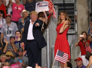 U.S. President Donald Trump and Melania Trump are seen during a campaign rally at the AeroMod International hangar at Orlando Melbourne International Airport on Feb. 18, 2017 in Melbourne, Fla. (Joe Raedle/Getty Images)