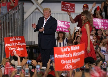 U.S. President Donald Trump and Melania Trump are seen during a campaign rally at the AeroMod International hangar at Orlando Melbourne International Airport on Feb. 18, 2017 in Melbourne, Fla. (Joe Raedle/Getty Images)