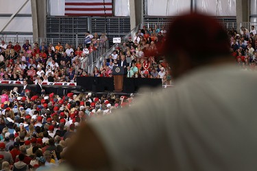 People listen as U.S. President Donald Trump speaks during a campaign rally at the AeroMod International hangar at Orlando Melbourne International Airport on Feb. 18, 2017 in Melbourne, Fla. (Joe Raedle/Getty Images)