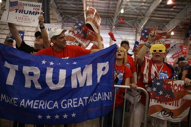 People attend a campaign rally for U.S. President Donald Trump at the AeroMod International hangar at Orlando Melbourne International Airport on Feb. 18, 2017 in Melbourne, Fla. (Joe Raedle/Getty Images)