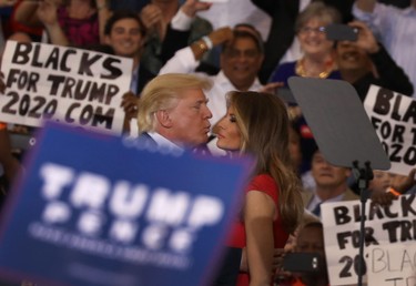 U.S. President Donald Trump kisses his wife Melania Trump during a campaign rally at the AeroMod International hangar at Orlando Melbourne International Airport on Feb. 18, 2017 in Melbourne, Fla. (Joe Raedle/Getty Images)