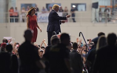U.s. President Donald Trump and first lady Melania Trump attend the "Make America Great Again Rally" at Orlando-Melbourne International Airport in Melbourne, Fla., Saturday, Feb. 18, 2017.  (AP Photo/Susan Walsh)