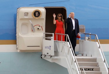 U.S. President Donald Trump and his wife, first lady Melania Trump arrive on Air Force One before the "Make America Great Again Rally" at Orlando-Melbourne International Airport Saturday, Feb. 18, 2017, in Melbourne, Fla. (AP Photo/Chris O'Meara)