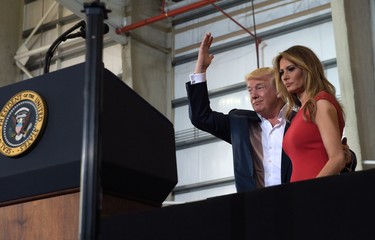 U.S. President Donald Trump and first lady Melania Trump arrive to speak at his "Make America Great Again Rally" at Orlando-Melbourne International Airport in Melbourne, Fla., Saturday, Feb. 18, 2017.  (AP Photo/Susan Walsh)