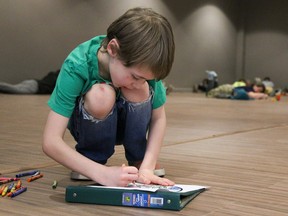 Seven-year-old Logan Bird-Robertson participates in a world record attempt of the most people colouring in one place on Sunday February 19, 2017 in Belleville, Ont. The event, titled Colouring our Community, was a fundraiser for the United Way. Tim Miller/Belleville Intelligencer/Postmedia Network