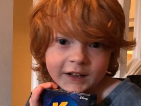Everett Botwright holds a package of Star Wars Kraft Dinner in Nanaimo, B.C. in a family handout photo. Hundreds of boxes of a limited-edition pasta now fill the home of a family in Nanaimo, B.C., following a plea to help their autistic son. (THE CANADIAN PRESS/HO-Reed Botwright)