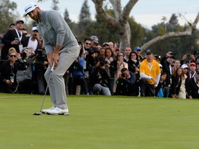 Dustin Johnson putts on the 18th hole during the final round at the Genesis Open at Riviera Country Club on February 19, 2017 in Pacific Palisades, California. (Photo by Robert Laberge/Getty Images)