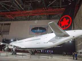 Air Canada unveiled the airline's new lettering on one of the company's planes in Montreal, Thursday, Feb.9, 2017. (THE CANADIAN PRESS/Ryan Remiorz)