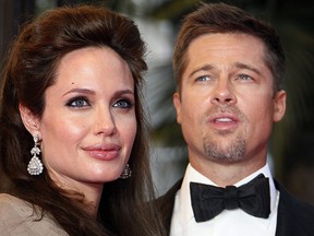 Angelina Jolie (L) and Brad Pitt pose on a red carpet at  the 61st Cannes International Film Festival in this May 20, 2008 file photo.   (FRANCOIS GUILLOT/AFP/Getty Images)
