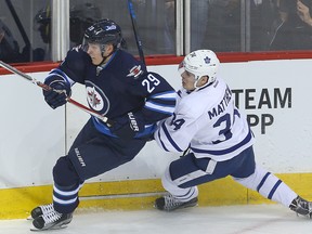 Winnipeg Jets right winger Patrik Laine and Toronto Maple Leafs center Auston Matthews battle during NHL hockey in Winnipeg, Man. Wednesday October 19, 2016. They'll square off again to open the season in Winnipeg, Wednesday, Oct. 4, 2017. Winnipeg Sun Files