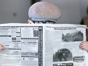 Seven-year-old Maeson Dorland attempts to go incognito during a Family Day spy school event at the National Air Force Museum of Canada on Monday February 20, 2017 at CFB Trenton, Ont. Maeson, along with his younger brother Maddox, dressed up as spies complete with old-style briefcases filled with newspapers they could hide behind. Tim Miller/Belleville Intelligencer/Postmedia Network