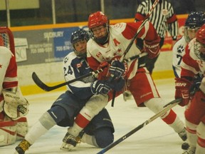 Nickel Caps' Nik Valliant battles with a Sault Greyhounds player for a loose puck during GNML semifinal action at Gerry McCrory Countryside Sports Complex. The Nickel Caps won 3-2 in double overtime. Keith Dempsey/For The Sudbury Star