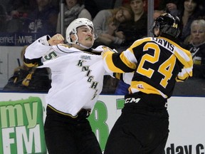 London Knights Cole Tymkin and Kingston Frontenacs Cal Davis have a severe disagreement during the second period of Ontario Hockey League action at the Rogers KRock Centre in Kingston, Ont. on Sunday February 19, 2017. The fight resulted in five-minute majors for each. (Steph Crosier, Postmedia News)