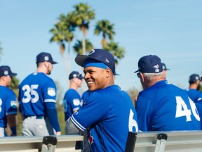 Toronto Blue Jays starting pitcher Marcus Stroman laughs with teammates before stretching during spring training in Dunedin on Feb. 20, 2017. (THE CANADIAN PRESS/Nathan Denette)