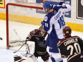 Peterborough Petes' goalie Dylan Wells blocks a shot deflected by Sudbury Wolves' Macauley Carson during second period OHL action on Thursday February 9, 2017 at the Memorial Centre in Peterborough, Ont. Clifford Skarstedt/Peterborough Examiner/Postmedia Network