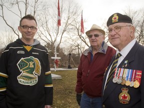 Shawn Lewis, Larry Laur and Sam Newman want to create a Vimy Ridge Park on some city land on the southeast corner of the roundabout at Hale and Trafalgar in London, Ont. (MIKE HENSEN, The London Free Press)