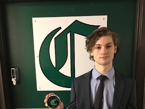 Sherwood Park Crusaders goalie Jake Morrissey holds the puck he used to score a last-second goal in a 3-1 win over the Camrose Kodiaks at the Sherwood Park Arena on Friday, Feb. 17, 2017. (Supplied)