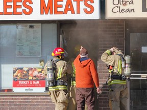 A number of businesses are now dealing with possible smoke and fire damage following a fire at a west-end strip mall Monday afternoon. (Julia McKay/The Whig-Standard)