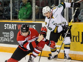 Ottawa 67's Kevin Bahl swipes the puck away from London Knights Dante Salituro during OHL action at TD Arena on Monday February 20, 2017. (Errol McGihon/Postmedia News)
