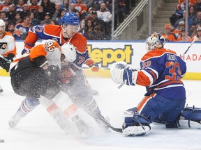 Philadelphia Flyers right wing Jakub Voracek is stopped by Edmonton Oilers goalie Cam Talbot with defenceman Oscar Klefbom coming to his aid in Edmonton on Feb. 16, 2017. (The Canadian Press)