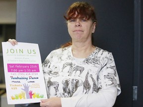 Anne Richards, a PSW, shows off a  poster for a fundraiser. Richards wants to open Annie's Place, a seniors daycare centre. (Gino Donato/Sudbury Star)