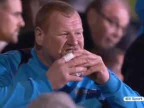 Sutton United reserve goalkeeper Wayne Shaw eats a meat pie during a match against Arsenal (@btsportfootball)