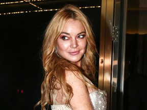 This Oct. 16, 2016 file photo shows actress Lindsay Lohan at the entrance of the Lohan Nightclub during the opening night in Athens, Greece. New York state’s highest court has agreed to allow Lohan to appeal her lawsuit against the makers of “Grand Theft Auto,” who the actress says used her likeness in the video game without permission. (AP Photo/Yorgos Karahalis, File)