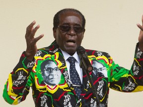In this Saturday, Dec, 17, 2016 file photo, Zimbabwean President Robert Mugabe addresses people at an event before the closure of his party's 16th Annual Peoples Conference in Masvingo, south of the capital Harare. Mugabe celebrates his 93 birthday Tuesday, Feb. 21, 2017, with celebrations set for Saturday. (AP Photo/Tsvangirayi Mukwazhi, File)