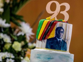 A picture taken on Feb. 21 shows a cake bearing a portrait of Zimbabwe President Robert Mugabe during a private ceremony to celebrate the despot's 93rd birthday in Harare. (AFP PHOTO)