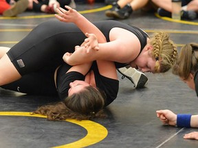 THS wrestler Addy Walker works on a pin at the COSSA mat finals held recently at THS. (Catherine Frost for The Intelligencer)