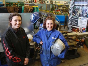 Claire Laing, left, and Hailey Megraw visit their Mechanical Pre-apprenticeship program shop at La Salle Secondary School in Kingston on Friday. Both students are now apprentices working in the fields they love. (Julia McKay/The Whig-Standard)