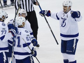 Tampa Bay Lightning centre Brian Boyle (11) celebrates his goal against the Winnipeg Jets with teammates defenceman Victor Hedman (77), centre Valtteri Filppula (51) and right wing Erik Condra (22) during first period NHL action in Winnipeg on Saturday, February 11, 2017.