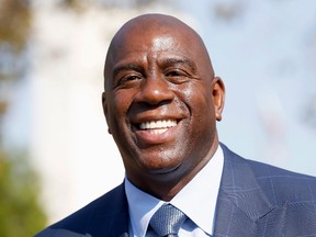 In an Aug. 23, 2016 file photo, former Los Angeles Lakers star Magic Johnson speaks at a groundbreaking ceremony for a stadium which will be home to the Los Angeles Football Club in Los Angeles. (AP Photo/Nick Ut, File)