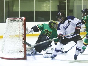 Lomond midget Lakers Ryan Strauss sends the puck into the net, scoring his team’s second goal in the second period, against the Okotoks Oilers last Thursday at the Lomond Community Centre. The Lakers won 6-3, making them Zone 5 champions. Jasmine O'Halloran Vulcan Advocate