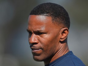 In this Tuesday, Aug. 18, 2015 file photo, actor Jamie Foxx watches during a joint NFL football training camp between the Dallas Cowboys and the St. Louis Rams, in Oxnard, Calif. Croatian police have filed charges against two people who allegedly used a racial slur to insult Hollywood actor Foxx in a restaurant. Police said they acted after receiving reports on Sunday, Feb. 19, 2017 of "particularly arrogant and rude" insults made against restaurant guests, including "one of the guests on racial grounds." (AP Photo/Mark J. Terrill, File)