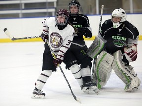 MacEwan Griffins goal-scoring leader Shyla Jans fights a rival defender for position in front of Red Deer Queens netminder Tracie Kikuchi in a regular-season ACAC game. They’ll meet again this week in a best-of-three women’s hockey semifinal, where Kikuchi’s .937 save percentage will be essential against Jans and the Griffins other offensive threats, led by Raven Beazer and Michelle Pochapsky. (