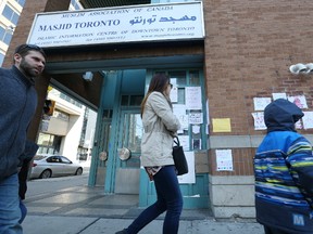 Signs of Muslim support are being posted on the wall of the Masjid Toronto, at 168 Dundas Street West in downtown Toronto. (Stan Behal/Toronto Sun)