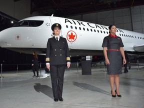 Pilot Stephanie Pilote, left, and flight attendant Nidia Carriel-Moreno model the new Air Canada uniforms in front of the new livery. (STEVE MACNAULL PHOTO)