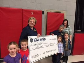 From left, Marsha Summerfield and Mary Alice Marchand, with the Kiwanis Club of Chatham-Kent, present a $1000 donation to Kindergarten teacher Rachel Garrow, Indian Creek Road Public School along with some of her students. The donation will go towards renovating the playground structure at the school.