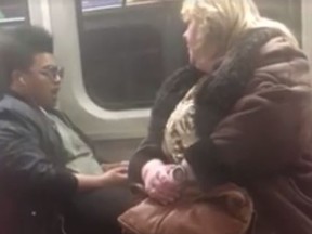A man and a woman in a confrontation over feet on the seat on a TTC subway on Sunday, Feb. 9, 2017. (Facebook video)