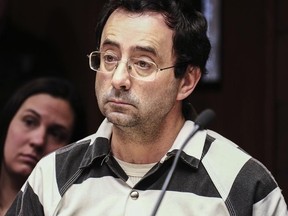 Dr. Larry Nassar listens to testimony of a witness during a preliminary hearing in Lansing, Mich., on Feb. 17, 2017. The former sports doctor at Michigan State University who specialized in treating gymnasts has been charged with sexual assault. (Robert Killips/Lansing State Journal via AP)