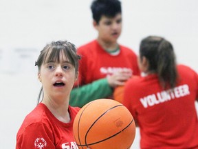 Sydney Vrolyk, 17, from Sarnia prepares to take a shot during the Sarnia chapter of Special Olympics Ontario's weekly basketball program at St. Anne Catholic Elementary School. The team is called the Sarnia Heat. Terry Bridge/Sarnia Observer/Postmedia Network